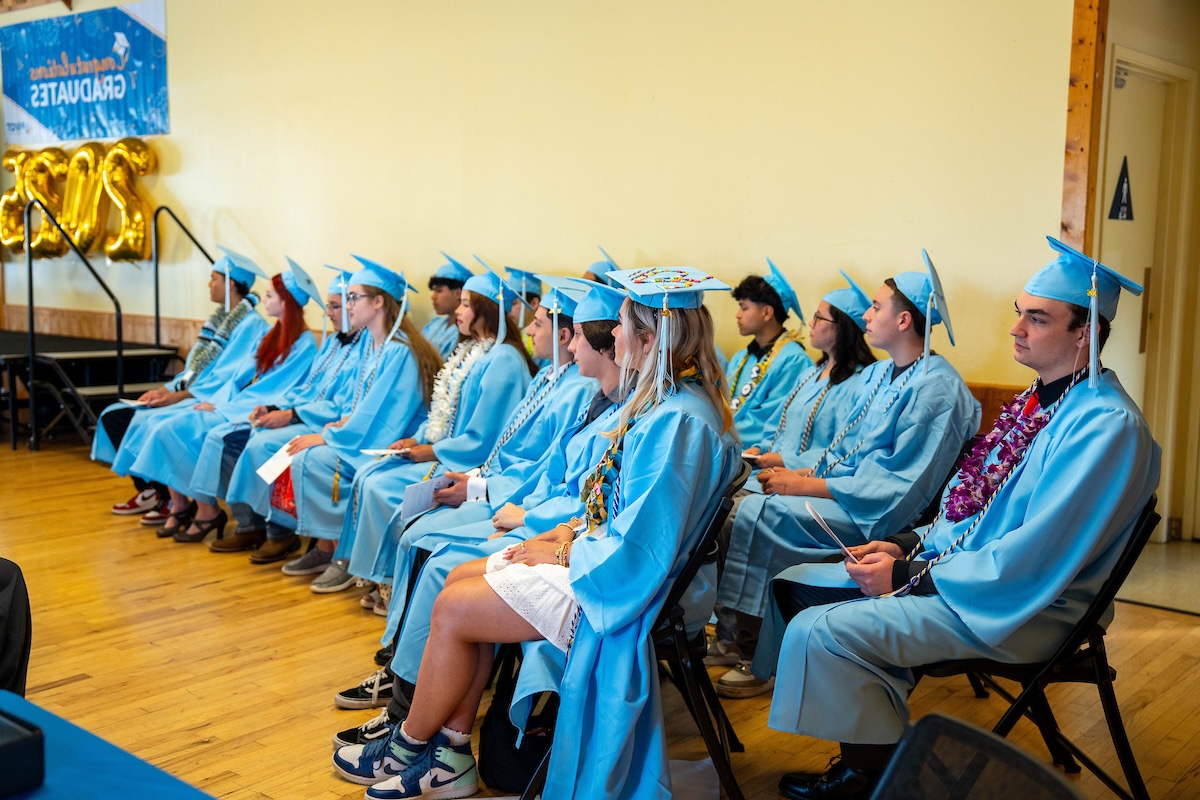 Pivot students sitting at graduation ceremony